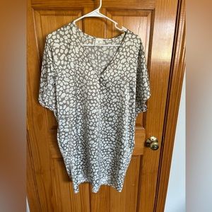 Never worn, silky material, dress with pockets